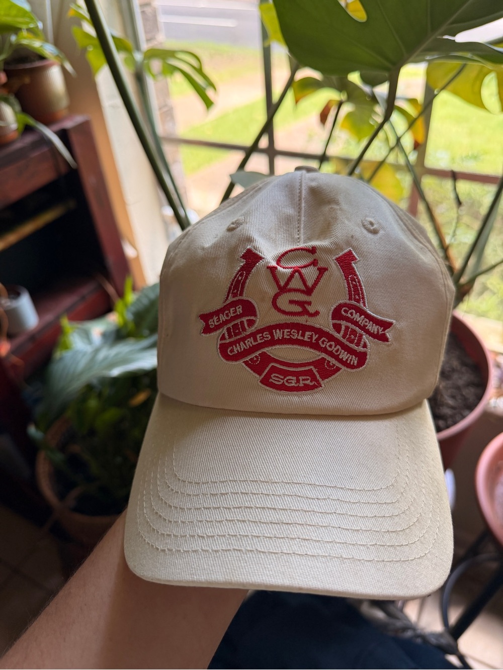 Charles Wesley Godwin Logo Embroidered Cream Baseball Cap